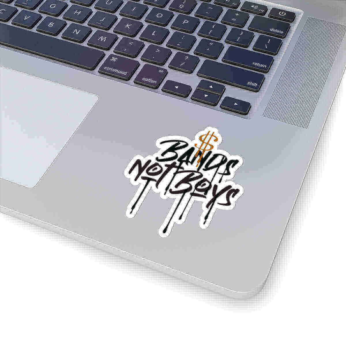 Urban Cookie Bands not Boys Kiss Cut money sticker on a laptop keyboard.