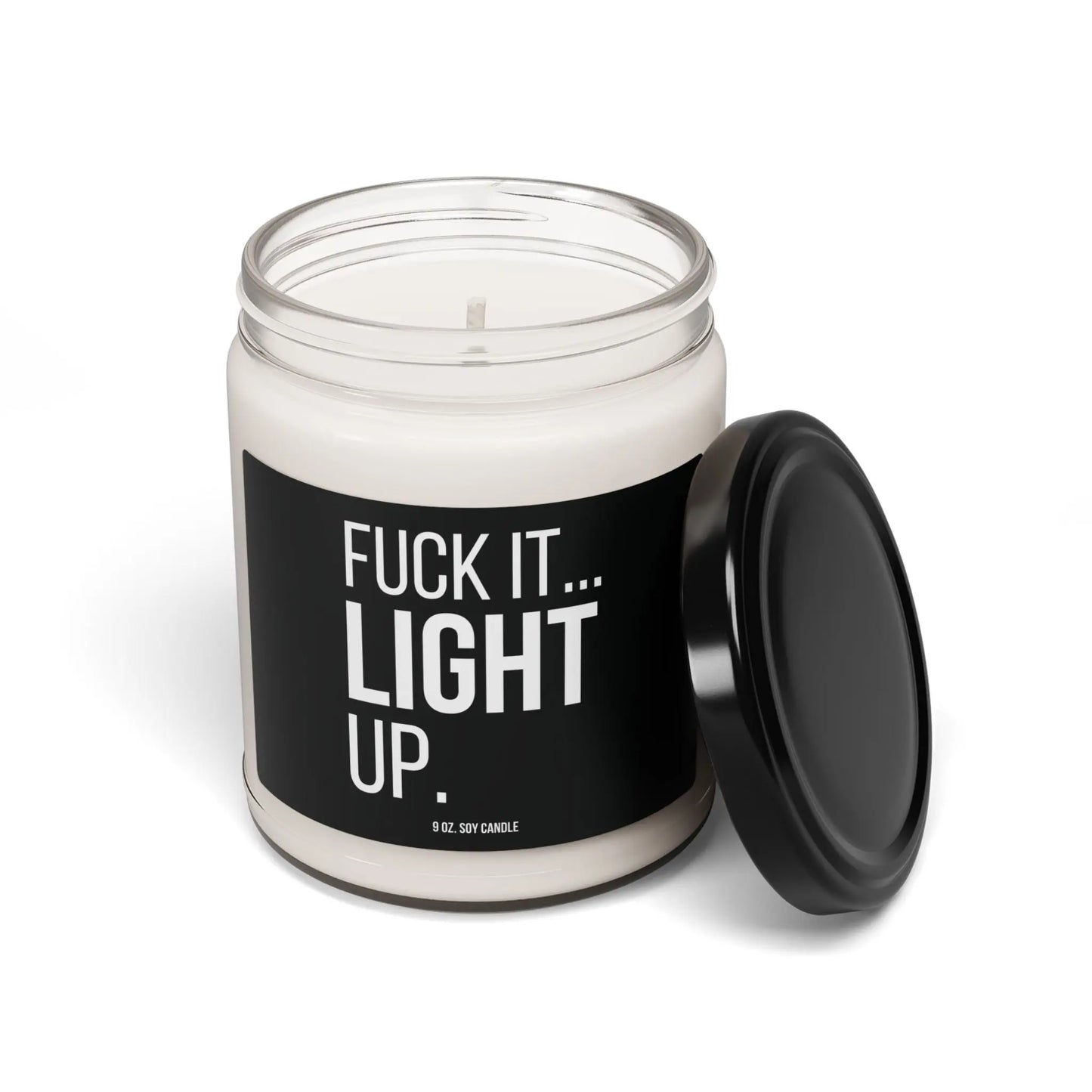 An open lid view of Urban Cookie’s edgy “Fuck It, Light Up” soy candle in a clear glass jar. Designed to add rebellious style and cozy ambiance to your space.