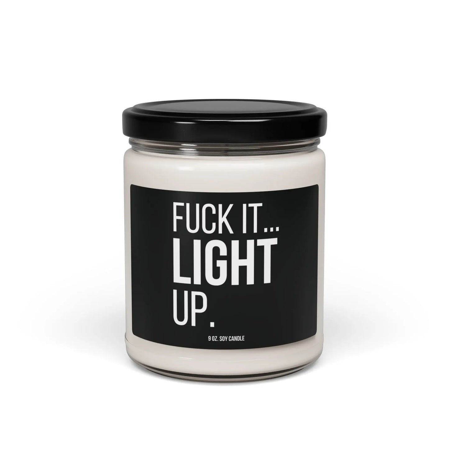 Urban Cookie’s edgy “Fuck It, Light Up” soy candle in a clear glass jar with White text on a black label and sleek black lid, designed to add rebellious style and cozy ambiance to your space.
