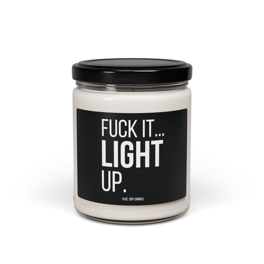 Urban Cookie’s edgy “Fuck It, Light Up” soy candle in a clear glass jar with White text on a black label and sleek black lid, designed to add rebellious style and cozy ambiance to your space.