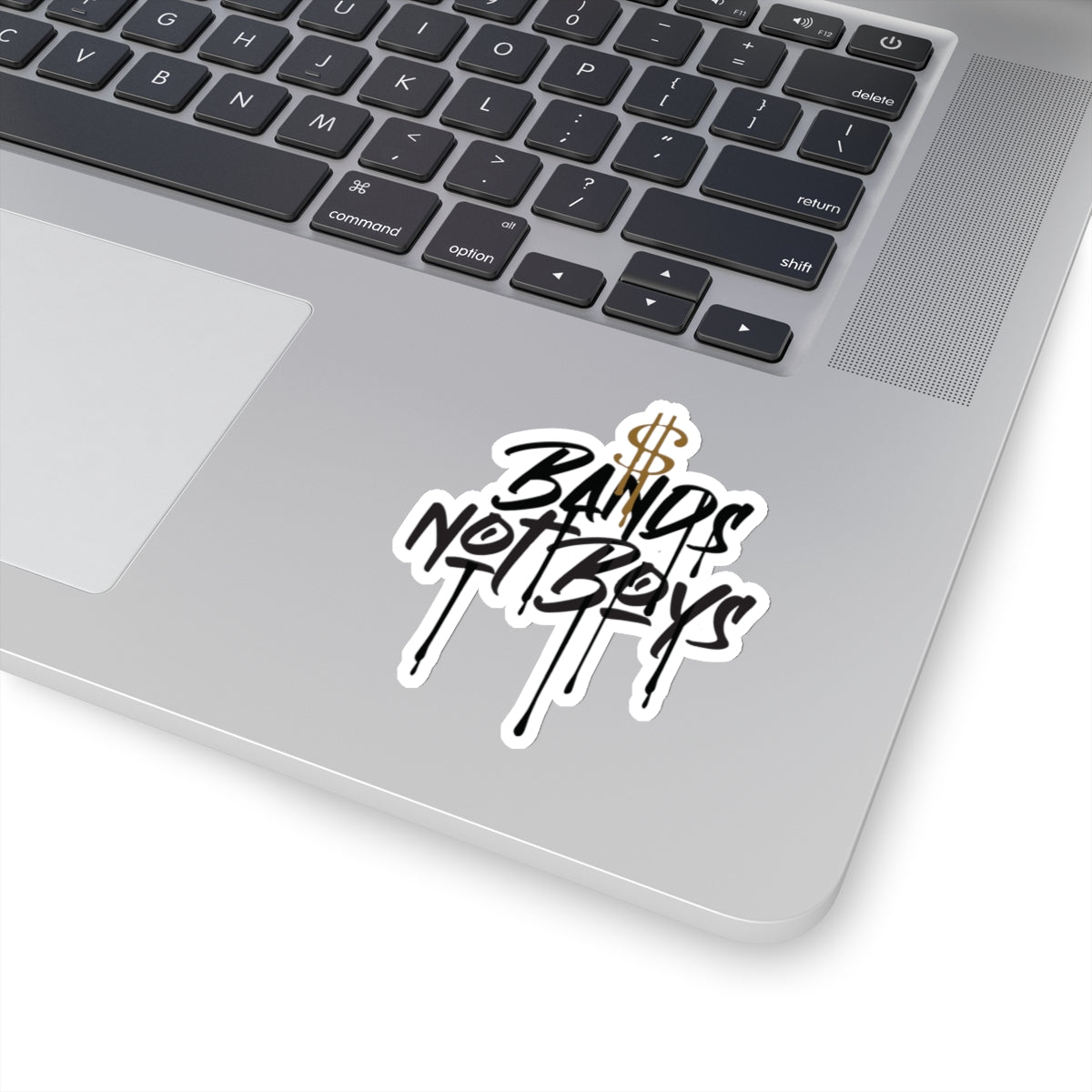 Urban Cookie Bands not Boys Kiss Cut sticker on a laptop keyboard.