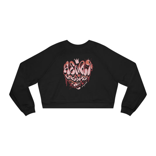 Black Urban Cookie Breaking Hearts crop top with retro graffiti heart shape drip design and a drippy crown. Flat lay on white background.