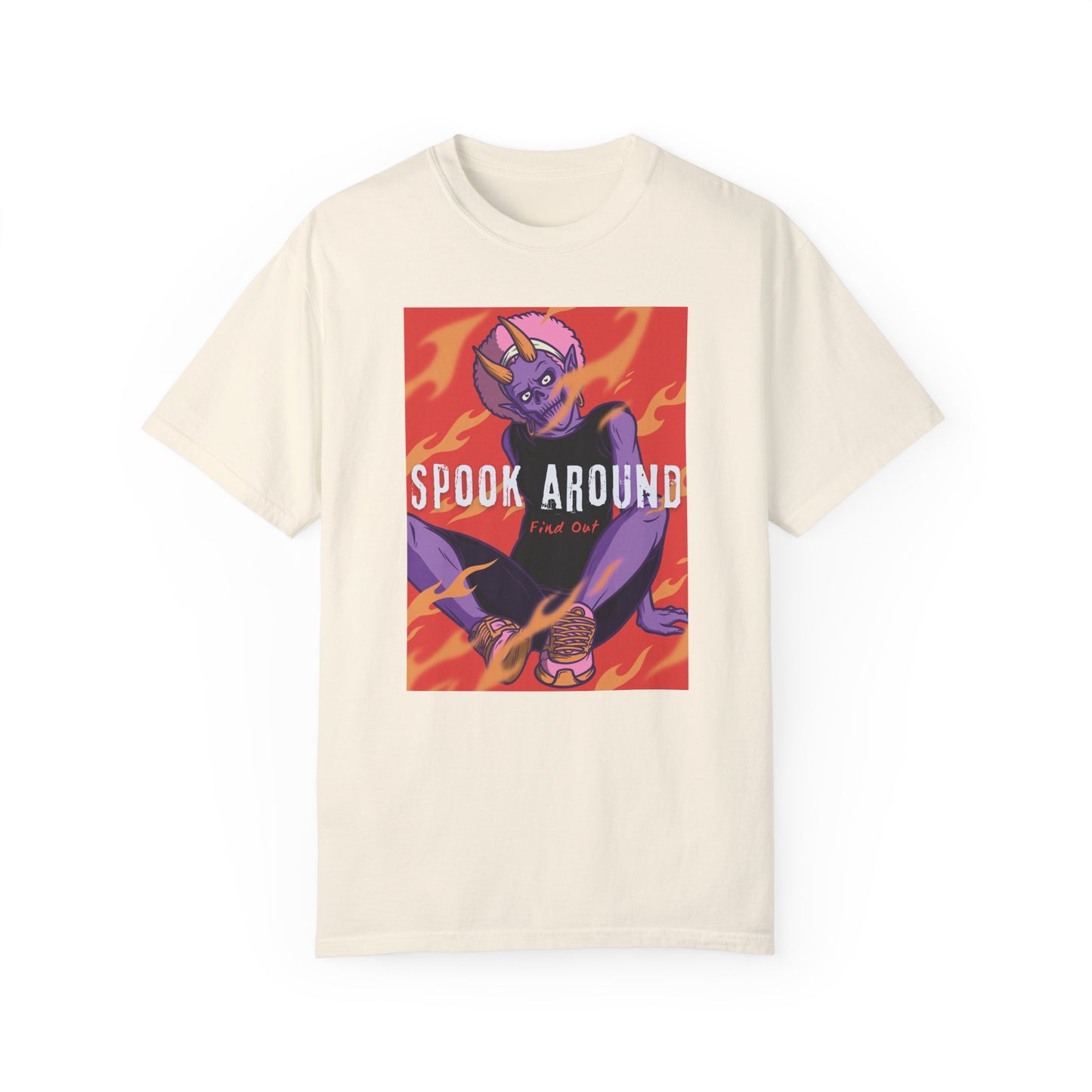 Ivory t-shirt with a casually dressed purple monster with horns wearing sneakers and earrings sitting in orange flames. Spook Around Find Out bold text.